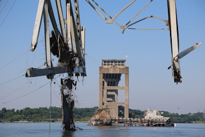 Steel from Francis Scott Key bridge being lifted from water