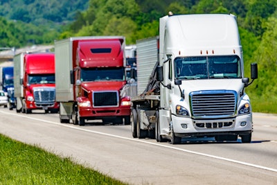 Line of big rigs on a highway