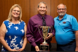 The Michigan Driving Championship's grand champion is Wayne Gootee, center