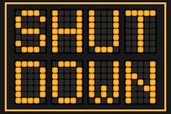 'Shut Down' in yellow on black background