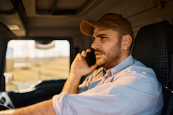Truck driver talking on cell phone while driving