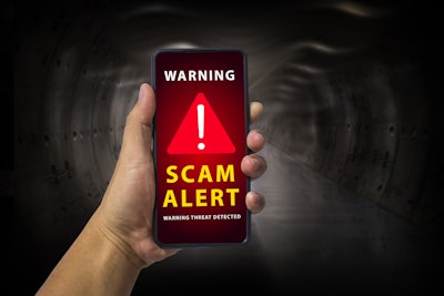 'Warning! Scam Alert' on smartphone