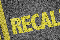 'Recall' in yellow on pavement
