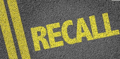 'Recall' in yellow on pavement