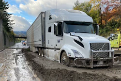 Tractor-trailer trapped in the mud