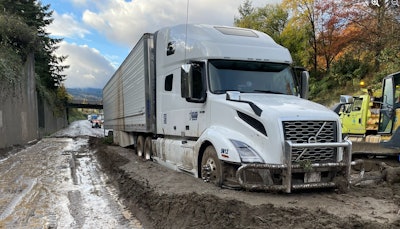Tractor-trailer trapped in the mud