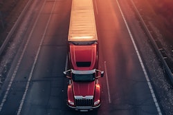 Big rig on highway at sunsey