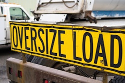 'Oversize Load' on yellow banner on truck