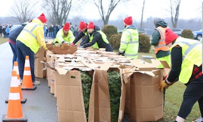 People unpacking memorial wreaths