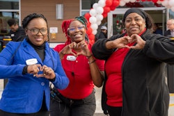 3 women making heart signs