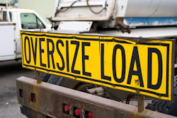 'Oversize Load' sign on front of truck