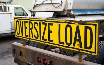 'Oversize Load' sign on front of truck