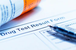 'Drug Test Results' form with pen and. vile