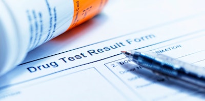 'Drug Test Results' form with pen and. vile