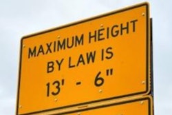 Truck height warning sign
