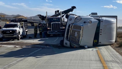 Tractor-trailer on its side in California