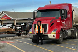 Pilot driver James Tench with tractor-trailer