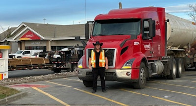 Pilot driver James Tench with tractor-trailer