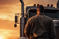 Driver in front of his truck