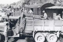 Soldiers with Red Ball Express trucks