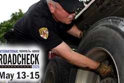 Law enforcement officer inspecting truck tires
