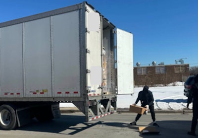 Cargo thieves stealing from stopped tractor-trailer