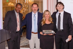 Bekins Director of Traffic Doug Robinson (left) presents Joe Childs (second from left) with the 2024 Bekins Driver of the Year award, which the celebrated driver accepted with his wife Cheri (second from right) and son Joey (far right) at his side.