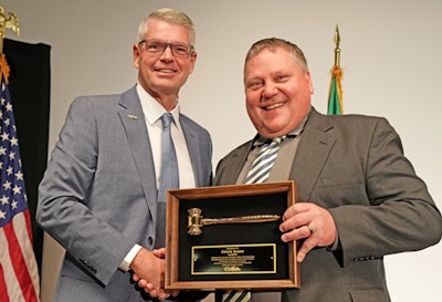 Derek Barrs (left) received the leadership recognition award from 2023-2024 CVSA President Col. Russ Christoferson, with the Montana Department of Transportation, at the 2024 CVSA Annual Conference and Exhibition.