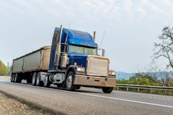 Blue tractor-trailer on highway