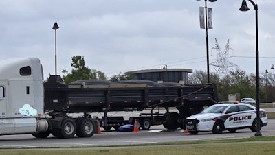 Police inspect tractor-trailer