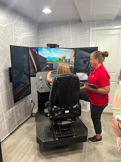 Children had the chance to use a truck driving simulator provided by Women In Trucking