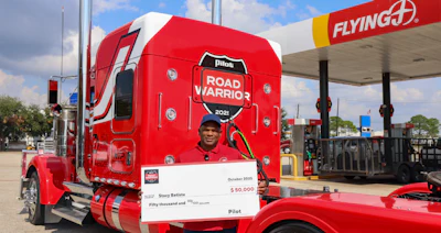Stacy Batiste with his custom Kenworth and $50,000