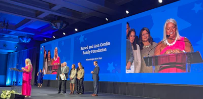 Julie Durr accepts the award on behalf of the Gerdin Family