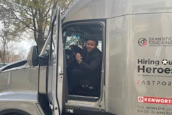 Charles Jones, Jr. in the Kenworth T680 he received for winning the Transition Trucking: Driving to Excellence Award