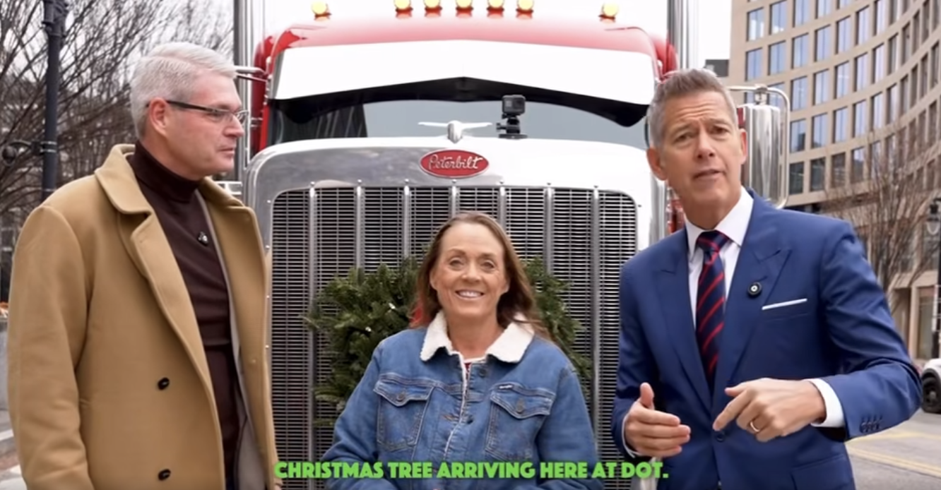 Ingrid Brown delivered the official Christmas tree to the U.S. Department of Transporation and was joined by FMCSA Administrator Derek Barrs (left) and Transportation Secretary sean Duffy (right)
