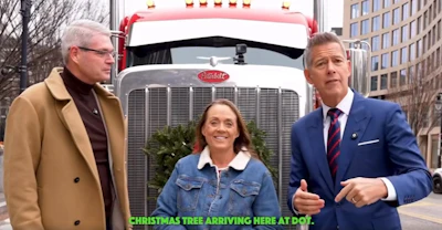 Ingrid Brown delivered the official Christmas tree to the U.S. Department of Transporation and was joined by FMCSA Administrator Derek Barrs (left) and Transportation Secretary sean Duffy (right)