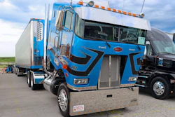 Dennis Sikorski's blue 1995 Peterbilt 362 and 2007 Great Dane reefer trailer “Old School & Flat Broke”
