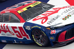 Number 54 NASCAR race car with red, white, and blue livery featuring SAIA and sponsor branding