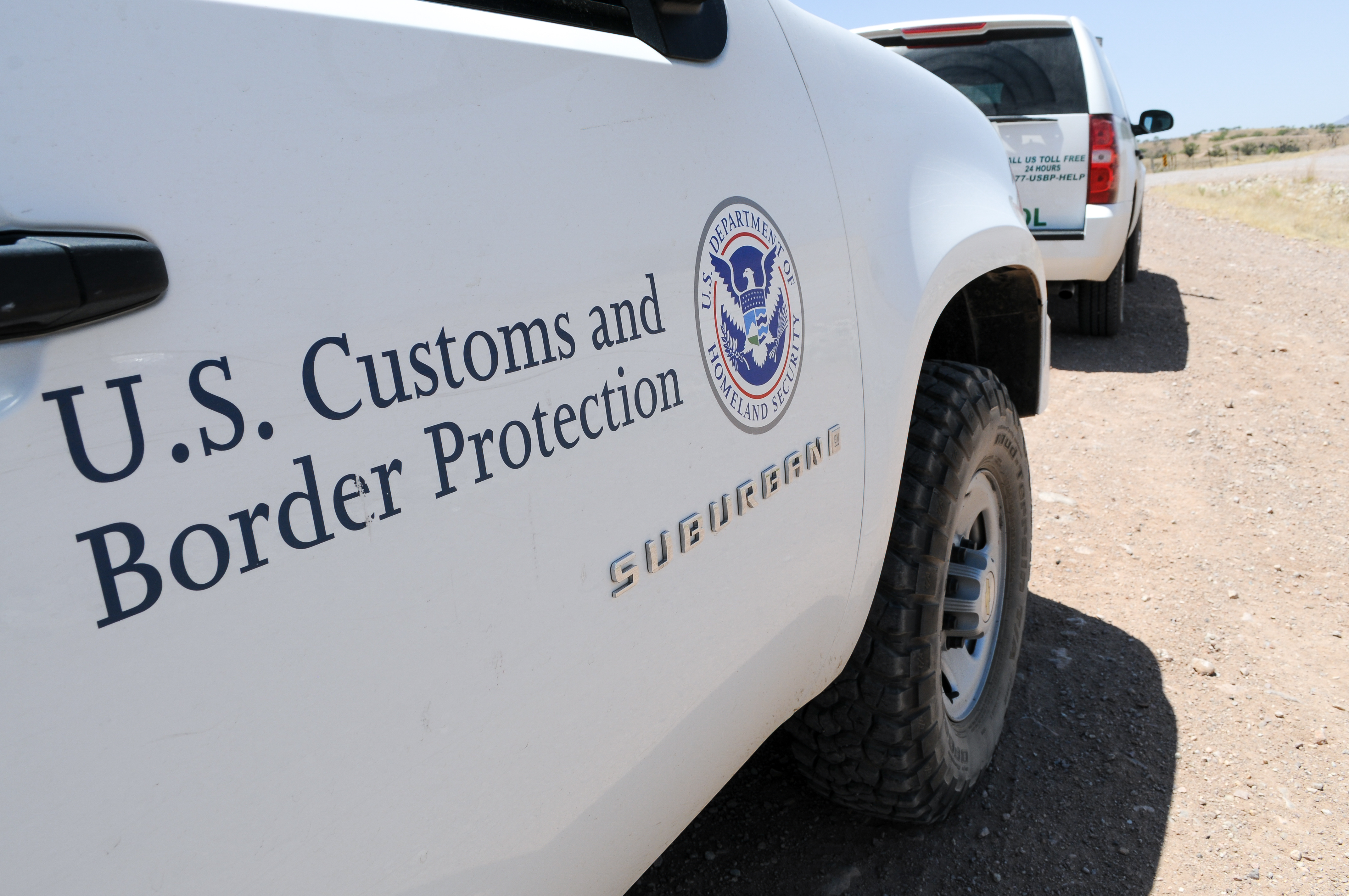 U.S. Customs and Border Protection vehicle parked in desert terrain