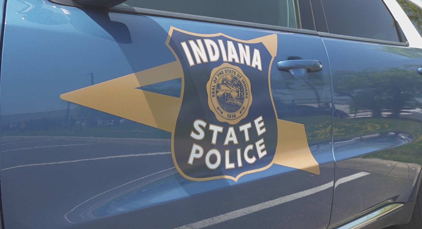 Indiana State Police badge decal on blue vehicle door