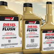 Three bottles of Power Service Diesel Injector & DPF Flush fuel system cleaner in tan bottles with black caps