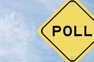 Yellow diamond-shaped poll sign with black border against cloudy sky