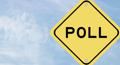 Yellow diamond-shaped poll sign with black border against cloudy sky