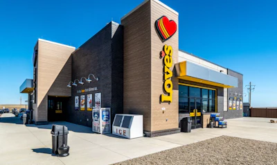 Love's Travel Stop building exterior with red heart logo and yellow signage under clear blue sky