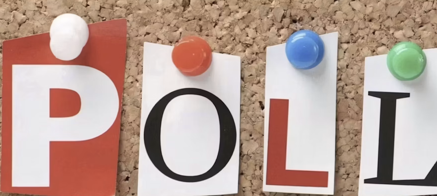 Colorful letter cards spelling POLL pinned to cork board with pushpins