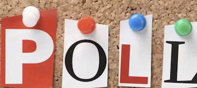 Colorful letter cards spelling POLL pinned to cork board with pushpins