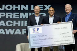 Three men in business attire holding a $5,000 ceremonial check from TCF at a Premier Achievement Award event.
